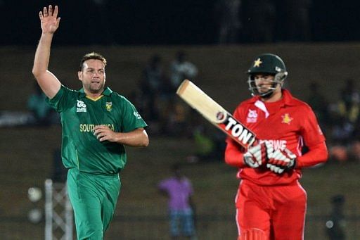 South African cricketer Jacques Kallis (L) celebrates after he dismissed Zimbabwe cricketer Graeme Cremer South African cricketer Jacques Kallis (L) celebrates after he dismissed Zimbabwe cricketer Graeme Cremer