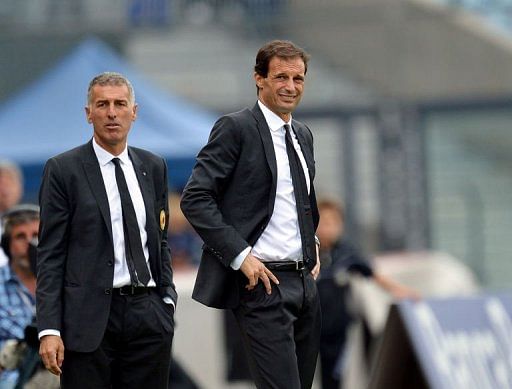 AC Milan's coach Massimiliano Allegri (R) grimaces next to his assistant Mauro Tassotti AC Milan's coach Massimiliano Allegri (R) grimaces next to his assistant Mauro Tassotti