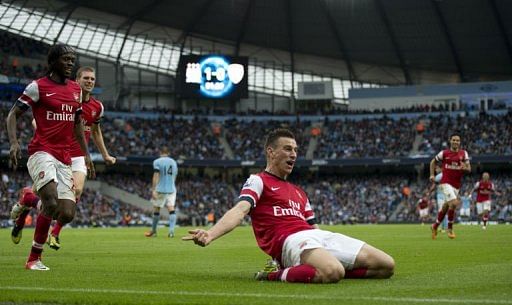 Arsenal's Laurent Koscielny celebrates scoring Arsenal's Laurent Koscielny celebrates scoring