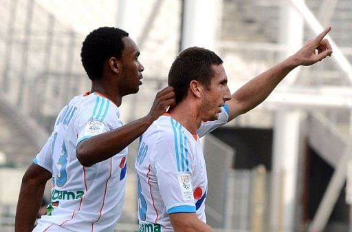 Marseille's Morgan Amalfitano (R) celebrates with Julio Nkoulou Marseille's Morgan Amalfitano (R) celebrates with Julio Nkoulou