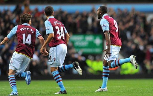 Aston Villa's Darren Bent (R) celebrates after scoring Aston Villa's Darren Bent (R) celebrates after scoring