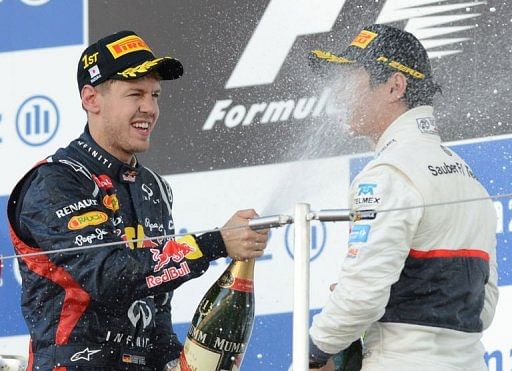 Vettel (left) became the first man this year to score back-to-back wins after a victory in Singapore Vettel (left) became the first man this year to score back-to-back wins after a victory in Singapore