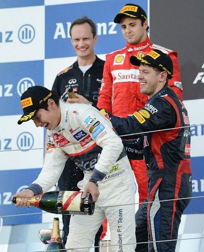 Kobayashi (front) became only the third Japanese driver to score a podium finish in Formula One Kobayashi (front) became only the third Japanese driver to score a podium finish in Formula One
