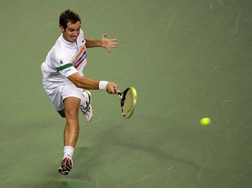 Richard Gasquet of France hits a return against Brian Baker of the US Richard Gasquet of France hits a return against Brian Baker of the US