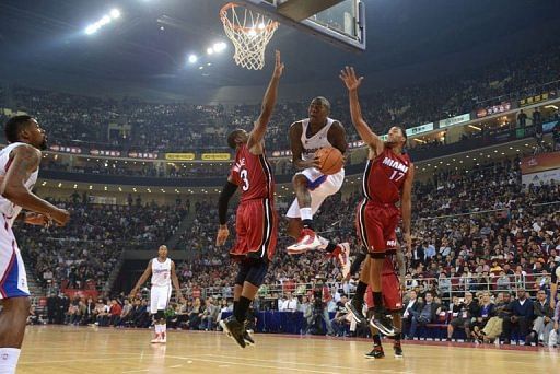 Jamal Crawford (C) of the Los Angeles Clippers jumps for the basket against Dwayne Wade of the Miami Heat Jamal Crawford (C) of the Los Angeles Clippers jumps for the basket against Dwayne Wade of the Miami Heat