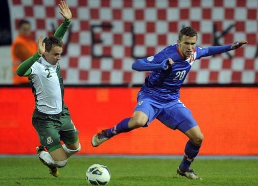 Croatia's Ivan Perisic (R) vies with Christopher Gunter of Wales Croatia's Ivan Perisic (R) vies with Christopher Gunter of Wales