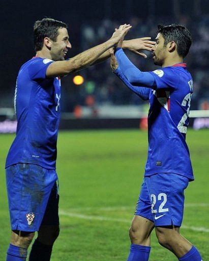 Croatia's Eduardo (R) celebrates with Darijo Srna after scoring Croatia's Eduardo (R) celebrates with Darijo Srna after scoring