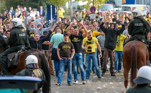 Eight police officers were hurt as fans went on the rampage in Dortmund Eight police officers were hurt as fans went on the rampage in Dortmund