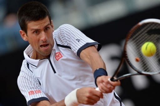 Djokovic into quarters, feels for injured Murray