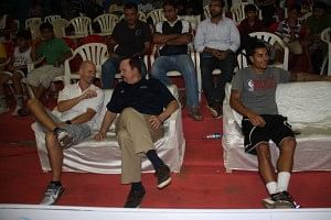 Coach Flemming (centre) with NBA India's Senior Director Troy Justice during the Ramu Memorial Tournament, Mumbai. 