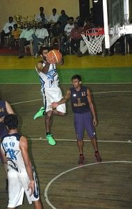 Forward Yadwinder Singh grabs a defensive rebound for ONGC.