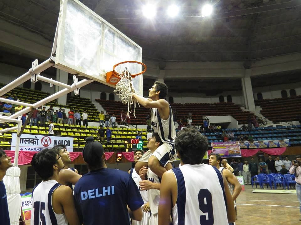 Delhi boys cut out the nets as keepsakes. Photo Courtesy: BFI
