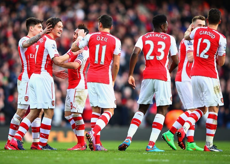 arsenal players ozil welbeck win emirates title race celebrate rosicky goal