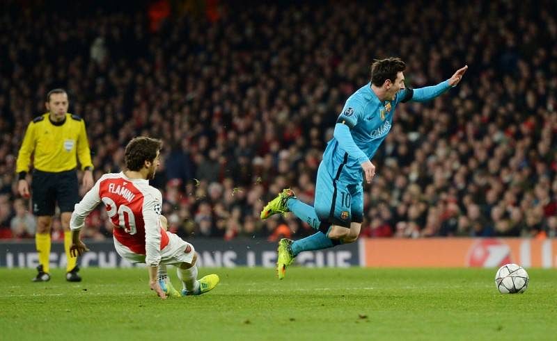 Messi weaves his magic as Barcelona beats Arsenal 2-0