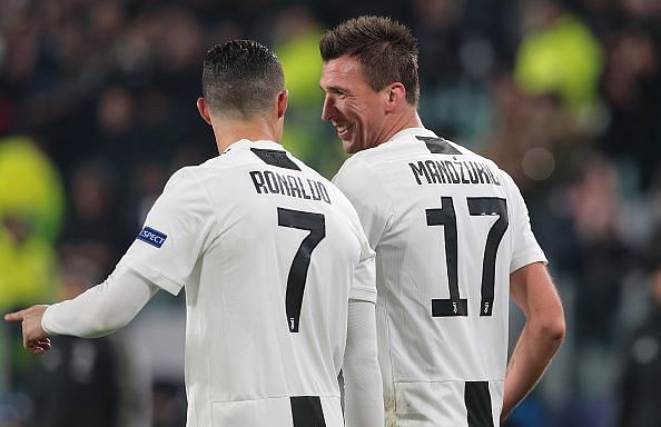 Ronaldo and Mandzukic celebrate the latter's important opener during their 1-0 win over Valencia