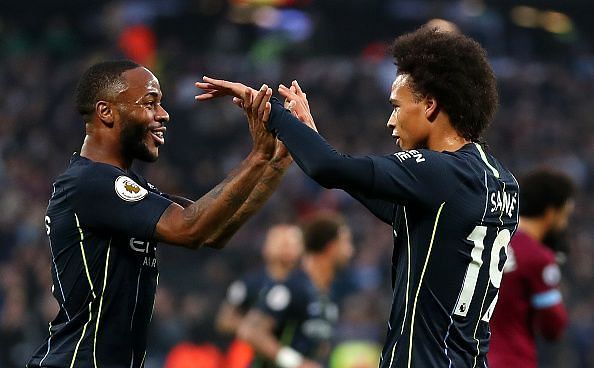 Sterling celebrates one of City's goals with Sane during their commanding victory