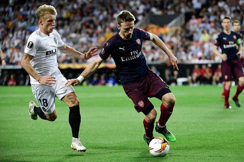 Monreal, during a duel for possession with Valencia's Daniel Wass