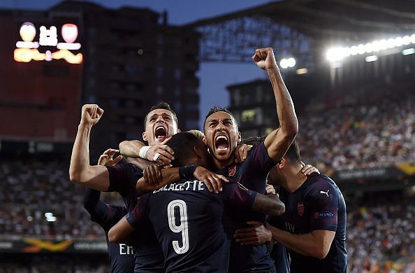 Arsenal players celebrate one of their goals during their Europa League semi-final win over Valencia