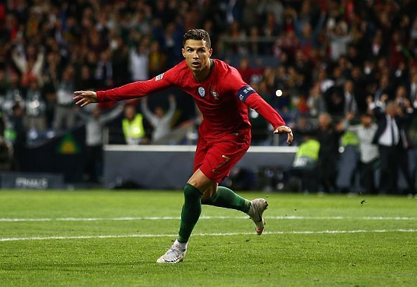 Who else? Ronaldo wheels away to celebrate his 53rd career hat-trick against a valiant Swiss effort