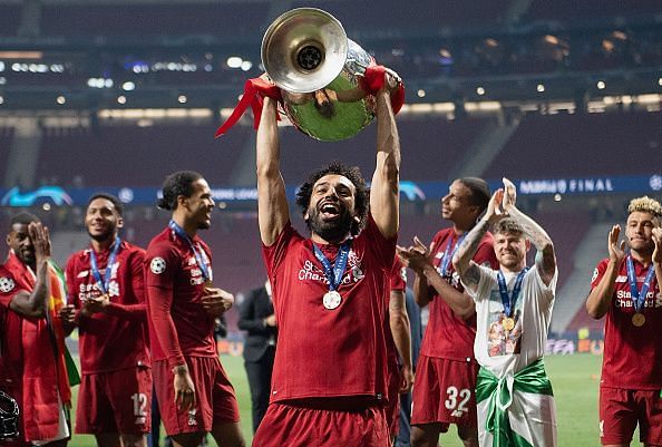 Salah celebrates with the UEFA Champions League trophy after their 2-0 win over Tottenham on June 1