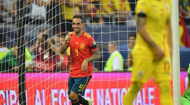 Alcacer celebrates his close-range finish to cap a well-worked Spain move, doubling their lead