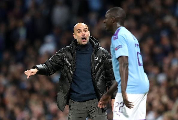 Manchester City's manager Pep Guardiola remonstrating with Benjamin Mendy