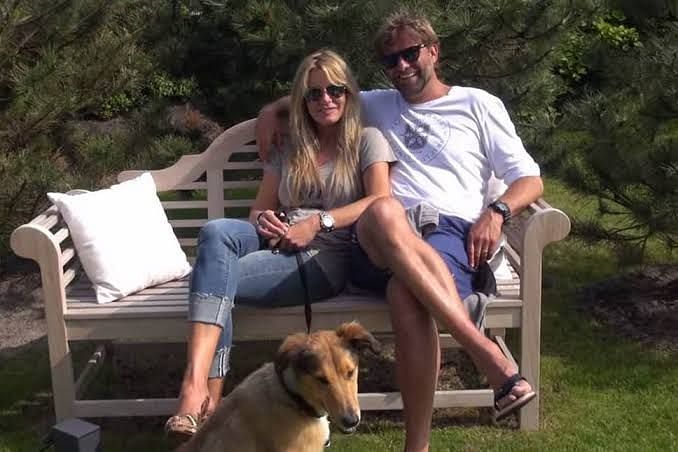 Klopp in a park with his wife and dog 