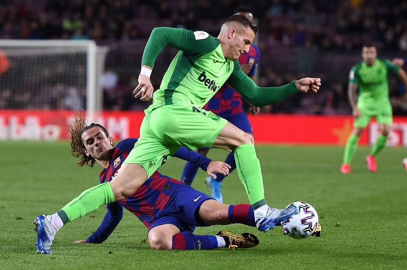 Tarin attempts to skip past Griezmann during a difficult evening's work for the visitors
