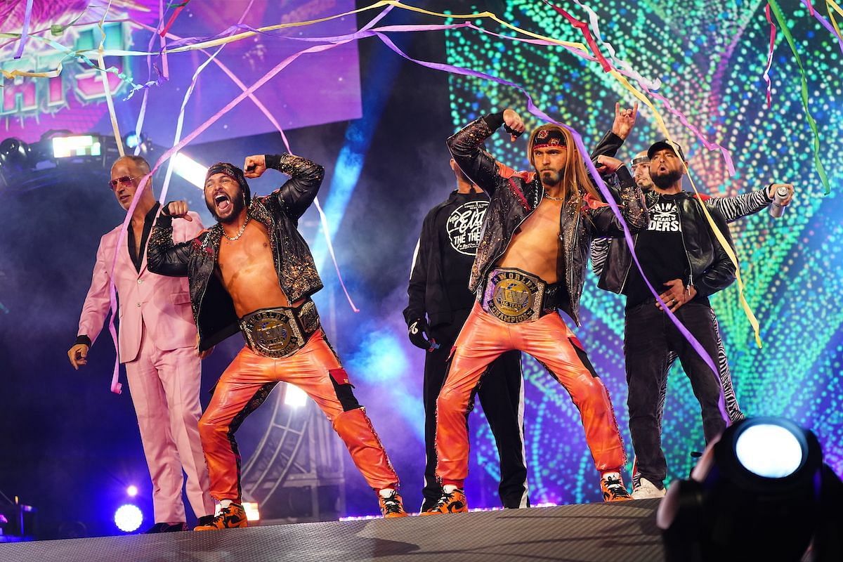 The Young Bucks wearing the AEW Tag titles.