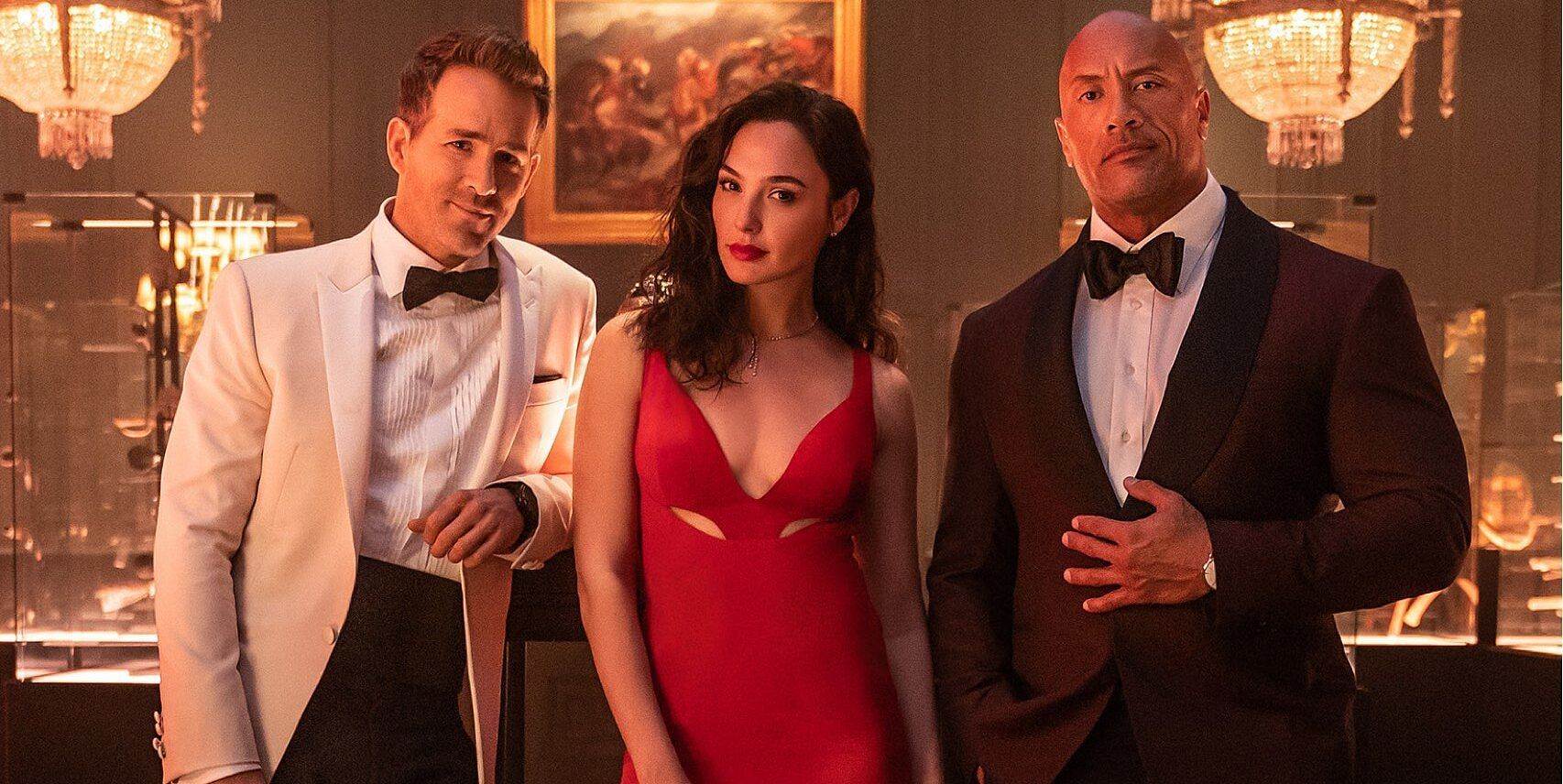 Red Notice main characters Ryan Reynolds, Gal Gadot, and The Rock