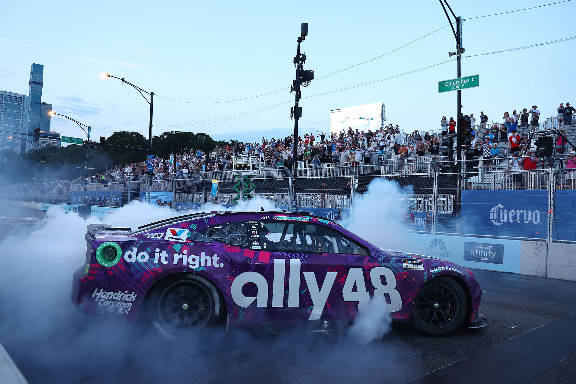 By how much did the inaugural NASCAR Chicago Street race overshoot the $25,000,000 budget?