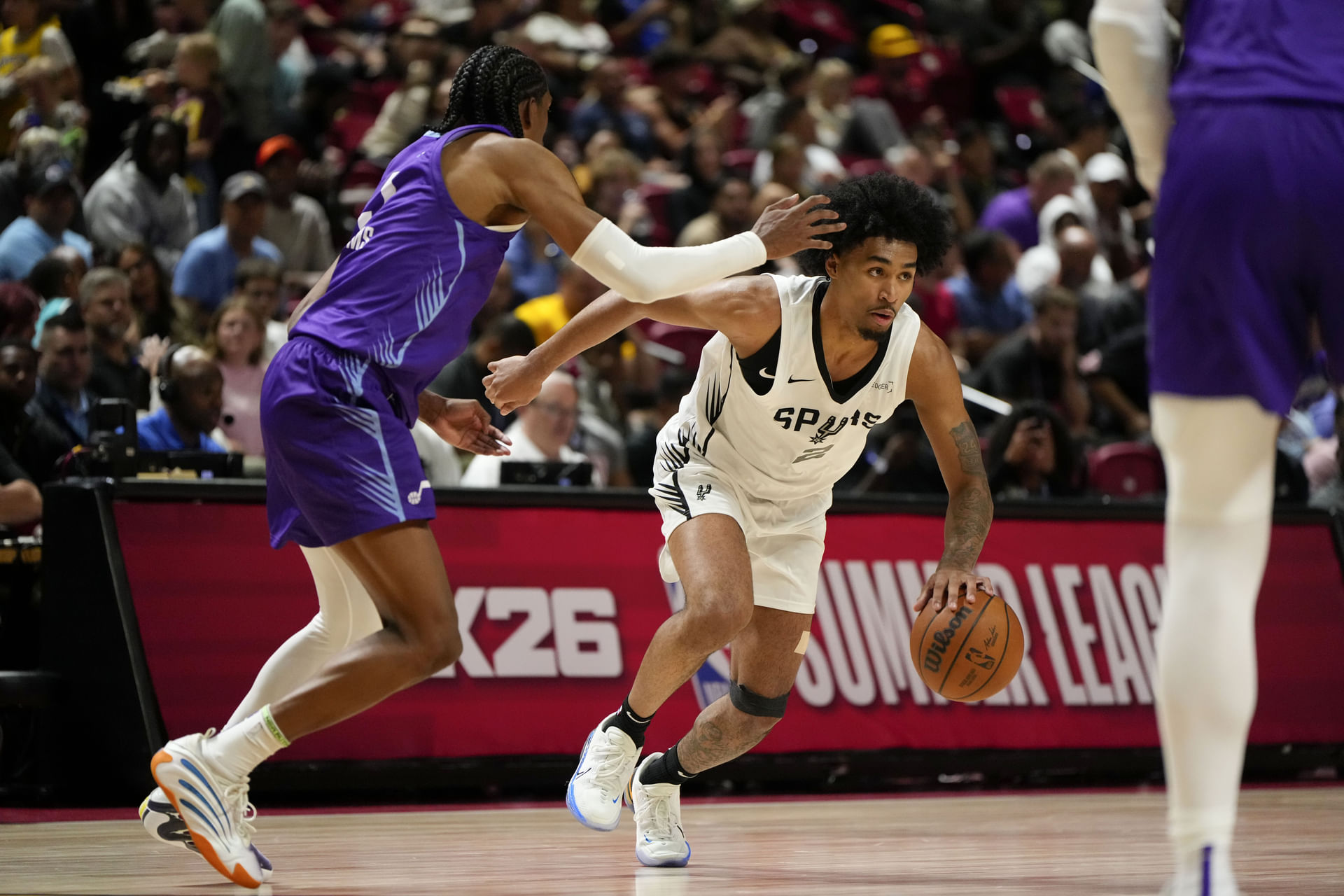 Dylan Harper dribbles the ball against Utah Jazz forward Cody Williams - Source: Imagn