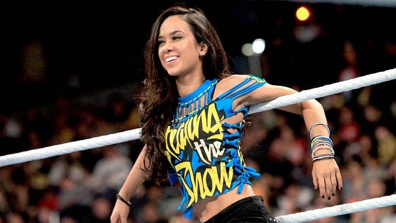 Why did AJ Lee retire from the WWE?