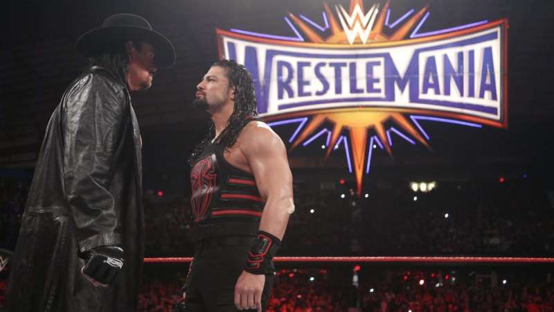 Roman Reigns calls out Undertaker for a rematch at a live event